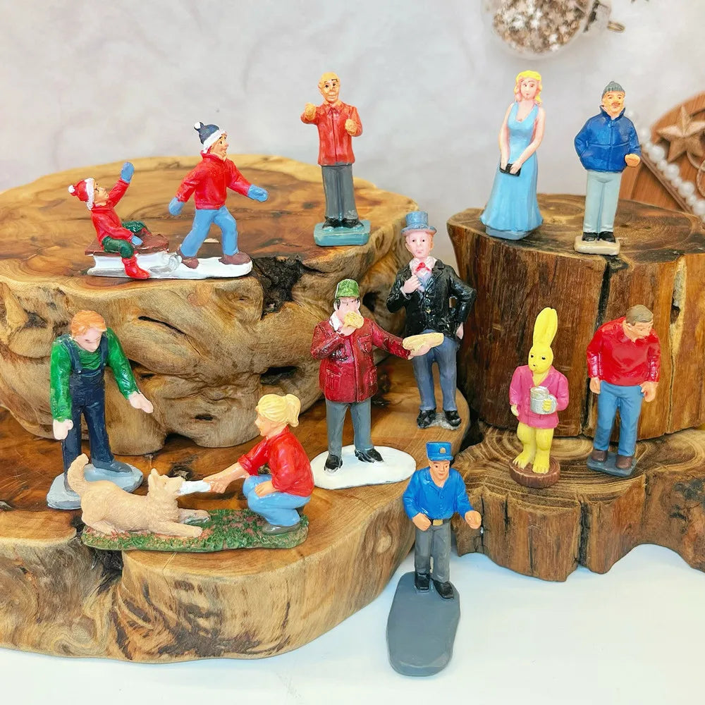 Scène de personnages pour village de Noël