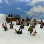 Personnage miniature de village de Noël (à l'unité)