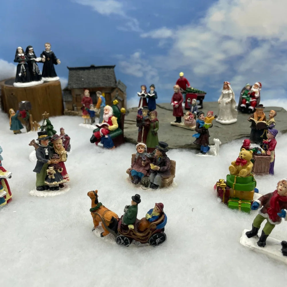 Personnage miniature de village de Noël (à l'unité)